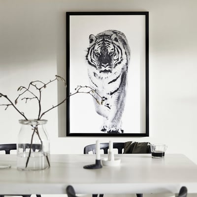 Large wall art: black-white tiger canvas; slim black frame; minimalist decor.