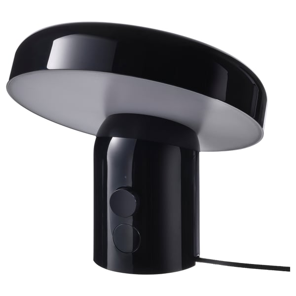 Black BLOMPRAKT speaker-lamp with rounded design, glossy finish, and dimmable light.