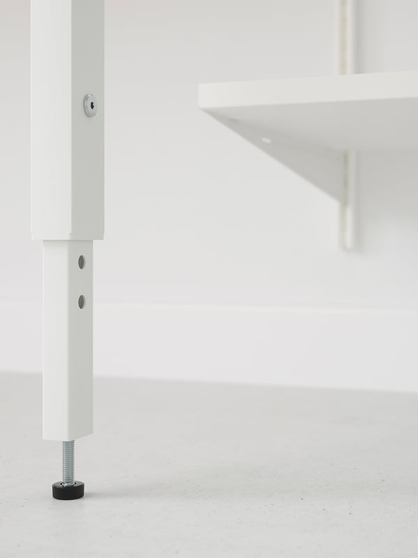 Close-up of BOAXEL storage unit leg, sleek design, sturdy metal and adjustable foot.