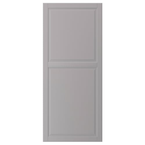 A grey BODBYN cabinet door with a smooth, rectangular shape and bevelled panels. It is simple and traditional in design.