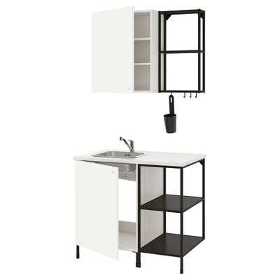 Modern, compact ENHET kitchen setup: white cabinet, black shelves, single-bowl sink, stainless steel tap.