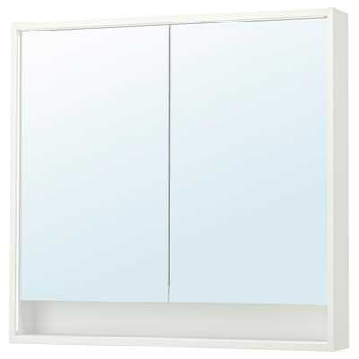 Depicts a white FAXÄLVEN mirror cabinet with built-in lighting, two doors, and an open shelf underneath.