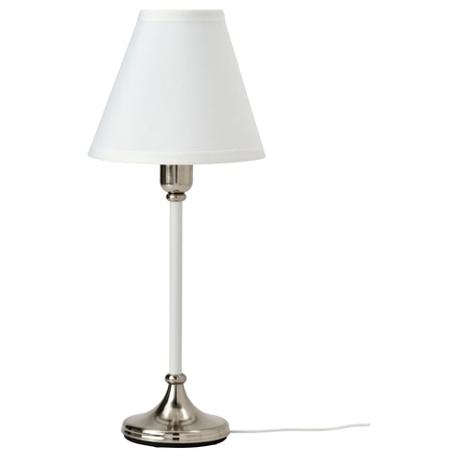 Elegant white table lamp with silver base and cord.