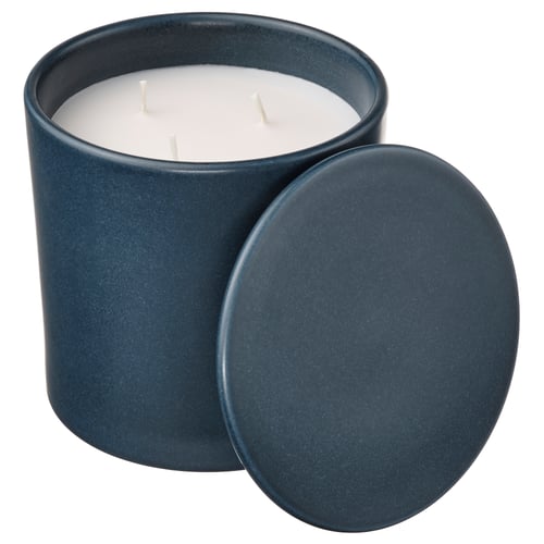 Blue ceramic candle jar with lid, three unlit wicks, rustic outdoor scent, suitable for home decor.