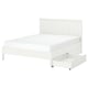 A white GULLABERG bed frame with storage drawers on castors, featuring a vertical slatted headboard and sturdy wooden legs.