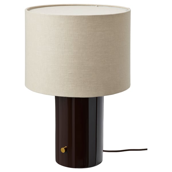 A HALGATT lamp with a black base and beige linen shade, featuring a sleek and modern design.