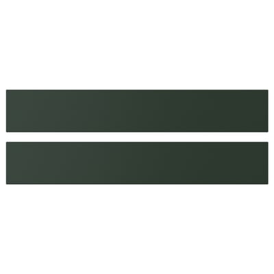 Two green rectangular shelves, part of IKEAs HAVSTORP series, with a smooth surface and straight lines, perfect for modern home decor.