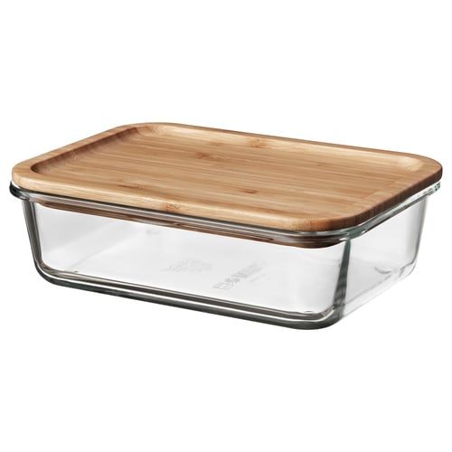 IKEA 365+ glass food container with bamboo lid for storing meals. Rectangular shape, clear glass, natural bamboo lid.