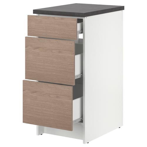 Modern white and light brown kitchen cabinet with three drawers, sleek design, wood-textured drawer fronts, stands on adjustable feet.