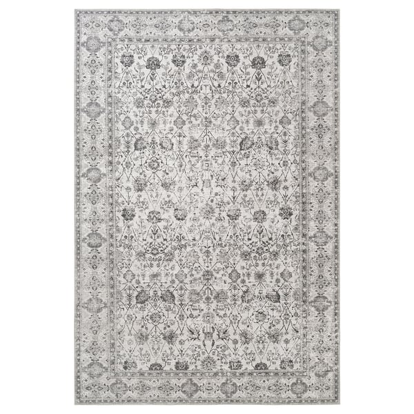 Localtåg grey area rug with intricate floral patterns, rectangular shape, made from recycled polyester.