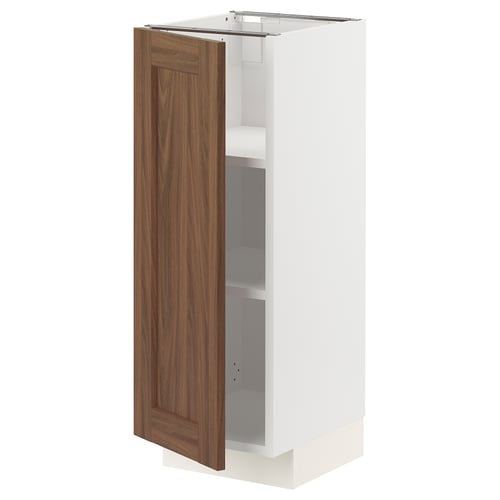 METOD kitchen unit with walnut door open, showcasing white shelves. Sleek, rectangular, wooden finish.