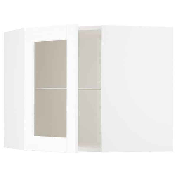 White METOD kitchen cabinets with frosted glass doors, featuring a classic design and wood texture.