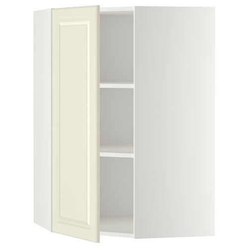 Off-white corner cabinet with one open door, adjustable shelf inside.