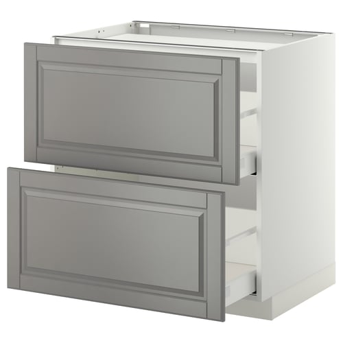 A white and grey METOD kitchen cabinet with two open drawers in a classic design.