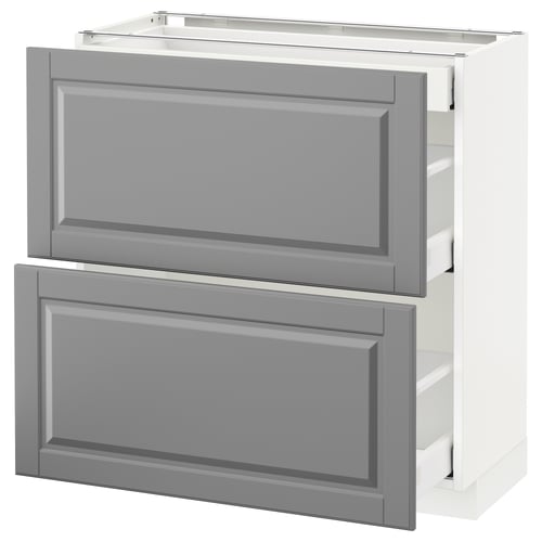 Displays a METOD kitchen cabinet in soft grey with bevelled edges, featuring two drawers and a boxy, elegant design.