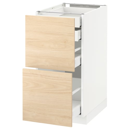 White METOD kitchen cabinet with light ash wood drawers.