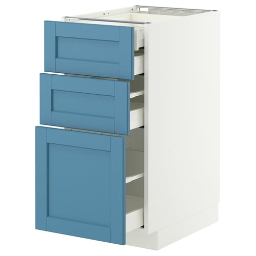 An IKEA METOD cabinet in white with blue drawers. It three drawers with a modern design, made from wood and metal.