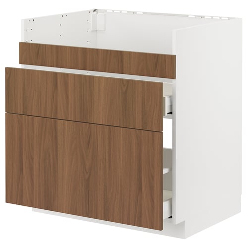 White METOD kitchen unit with walnut drawers.