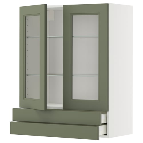 An olive green and white ikea METOD kitchen cabinet with glass doors and a drawer. It a modern design with a sturdy frame and tempered glass shelves.