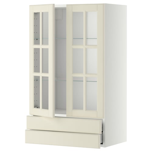 An off-white METOD kitchen cabinet with glass doors, featuring a classic design with bevelled edges and adjustable shelves.