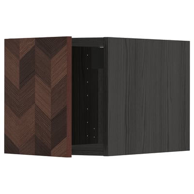 A dark, modern cabinet with a herringbone wood pattern and a left-side hinge door from the METOD kitchen series.