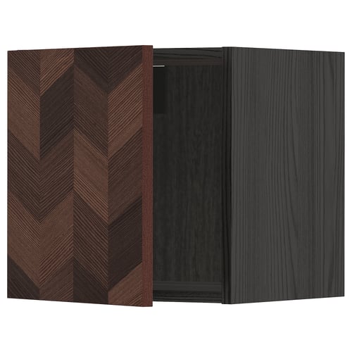 Dark wood-patterned cabinet door with herringbone design.