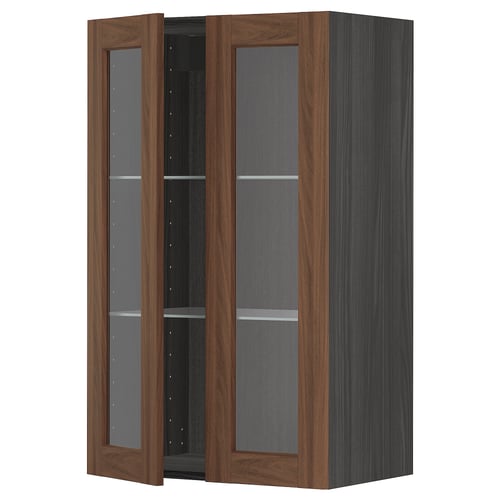 A dark wood-colored METOD kitchen cabinet with glass doors and shelves, offering a classic and stylish look.