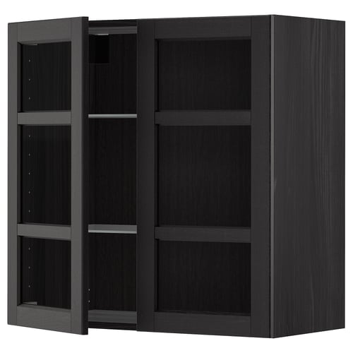 Black stained wooden kitchen cabinet with adjustable shelves and open door.