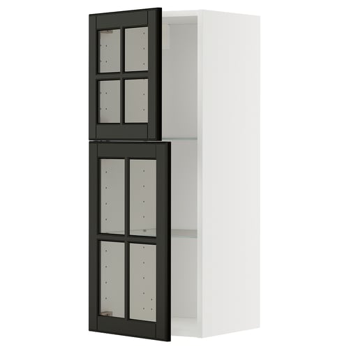 This image shows a white METOD kitchen cabinet with black bodbyn glass doors featuring bevelled edges and a sleek design.