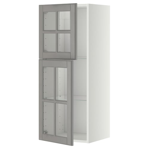 A METOD kitchen unit with grey bodbyn glass doors, showcasing a classic design with bevelled edges and an adjustable glass shelf.