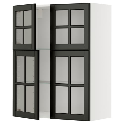 Modern kitchen unit with black glass doors and white shelves.