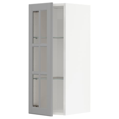 Open grey METOD kitchen cabinet with glass doors showcasing a modern design.