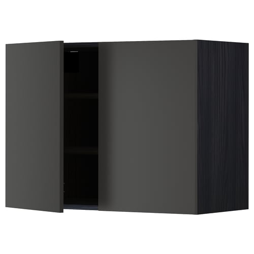 Modern black kitchen cabinet with one open door, sleek and square-shaped.