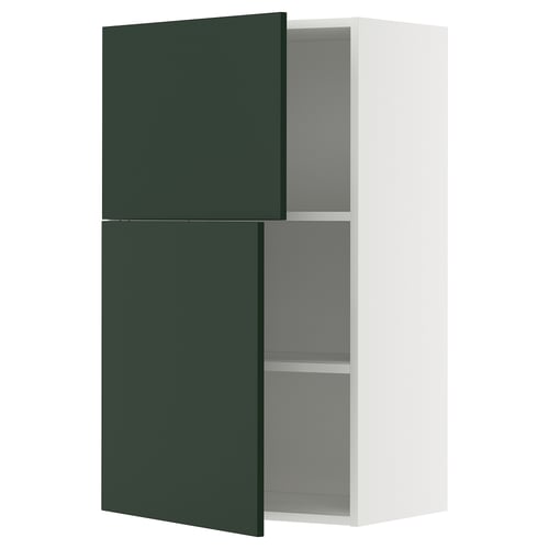 Modern kitchen cabinet with dark green doors and white frame.