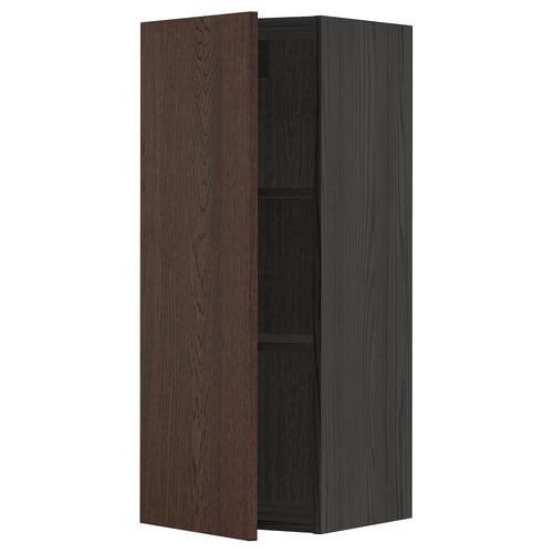 A dark brown and black kitchen cabinet with a door open, revealing an adjustable shelf inside.