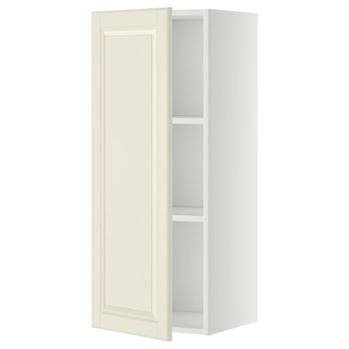 An off-white METOD wall cabinet with a bevelled door and two shelves inside, designed for kitchen storage.