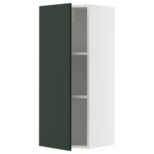 Modern METOD kitchen unit with 2 shelves, one door open, green colour, white frame, square shape.