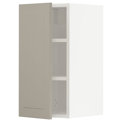 A beige METOD kitchen cabinet with a door and shelves.
