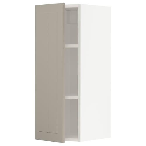 An open beige METOD kitchen cabinet from IKEA. It a tall, rectangular shape with two shelves inside.