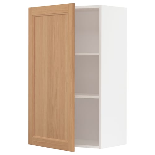 Wooden METOD wall cabinet in oak with white interior and adjustable shelf.
