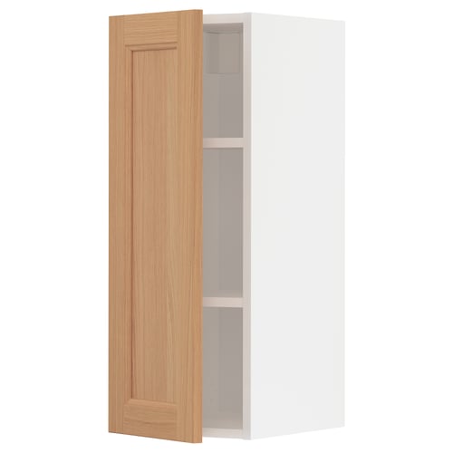 An open METOD kitchen cabinet with a wooden door in a light oak colour.