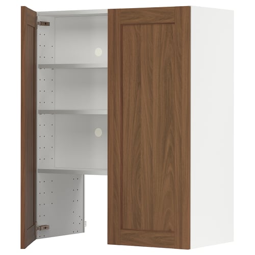 A brown wooden cabinet from the METOD kitchen system with an open door revealing white adjustable shelves.