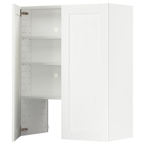 A white METOD kitchen cabinet with open doors, revealing adjustable shelves inside.