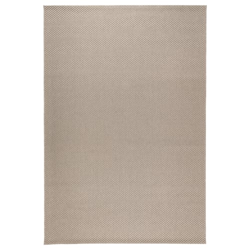 A rectangular MORUM rug in a neutral colour, made of polypropylene with a woven texture.