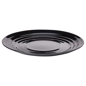 A black NÄTBARB dish, round in shape, made of tempered glass with a glossy, opaque surface showcasing a ripple pattern.