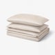 Natjasmin bed set: beige, sateen, rectangular, folded, subtle stripes.