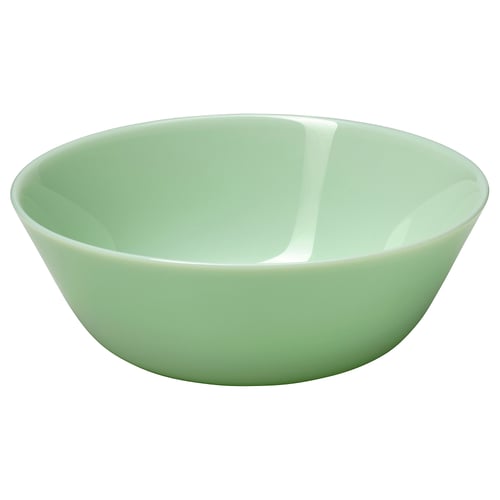 Light green glass bowl, round, smooth edges, simple design.