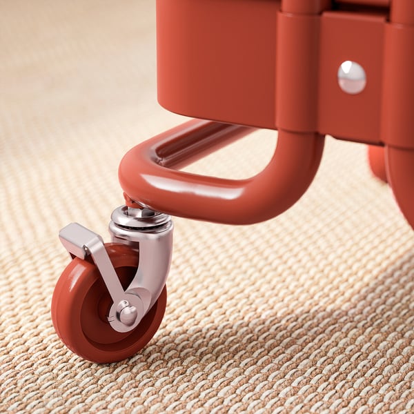 Close-up of red metal chairs wheel and base, showing quality design and sturdy construction.
