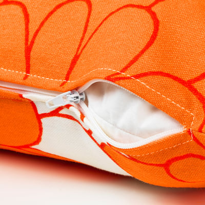 Bright orange and red floral-patterned pouch with sturdy zip, showcasing high-quality stitching and recycled materials.