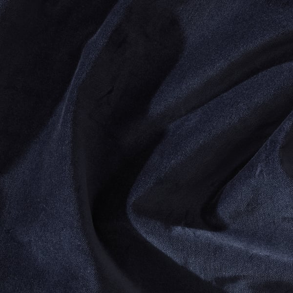 Close-up of luxurious navy-blue velvet fabric, showcasing its rich texture and elegant fall, perfect for curtains.